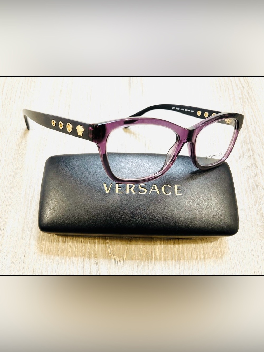 Versace Women's Translucent Purple eyeglasses frame, and case.